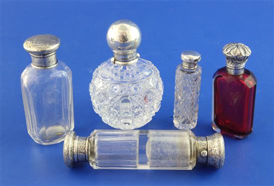 Five assorted Victorian and later mounted glass scent bottles, largest 4.75in.